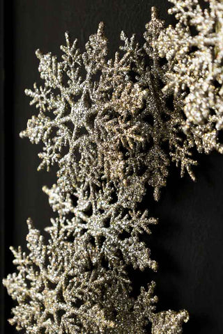 Close-up image of the Champagne Glitter Snowflake Wreath Decoration