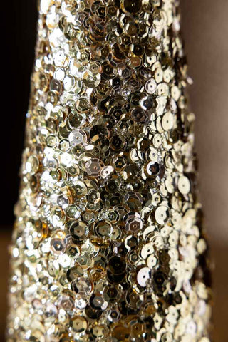 Close up of the sequin embellishment on the Champagne Gold Sequin Christmas Tree Cone. 