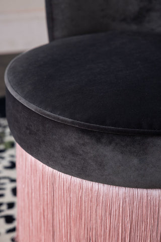Close-up image of the Charcoal & Pink Tassel Accent Chair