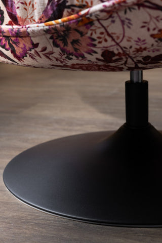 The black metal swivel base of the Charleston Garden Floral Velvet Swivel Chair. 