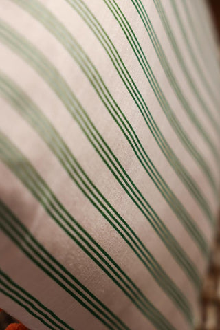 Image of the pattern on the Cotton Green Stripe Cushion with Orange Pom-Poms