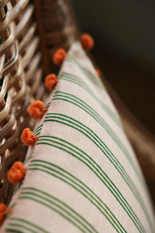 Image of the Cotton Green Stripe Cushion with Orange Pom-Poms