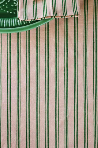 Detail image of the Cotton Green Stripe Table Cloth with Orange Pom-Poms