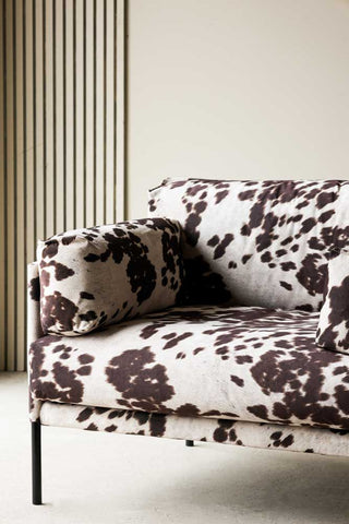Close-up image of the Cowhide Patterned Armchair