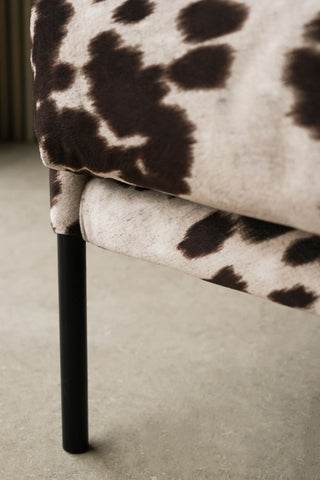 Image of the legs on the Cowhide Patterned Armchair