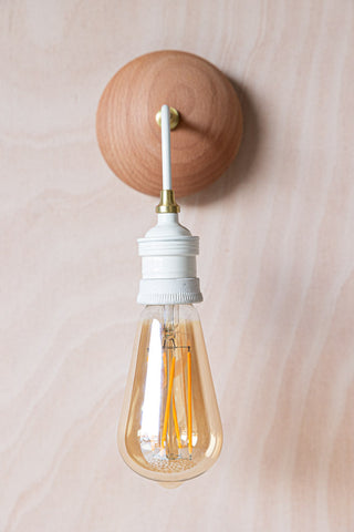 Close-up image of the Cream Metal & Glass Wall Light.