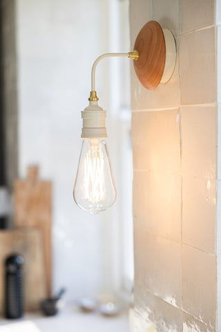 Lifestyle image of the Cream Metal & Glass Wall Light.