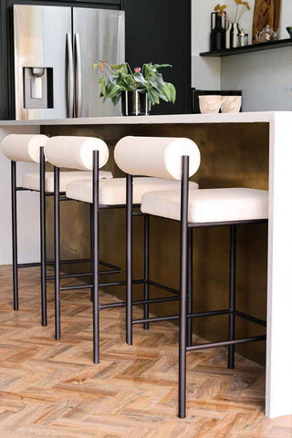 Lifestyle image of the Cream & Black Faux Leather Roll Back Bar Stool