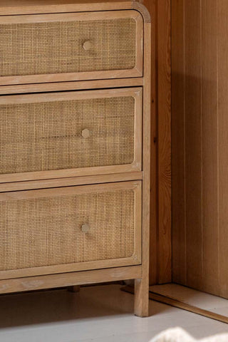 Close-up of the front of the Curved Wood & Rattan Chest Of Drawers.