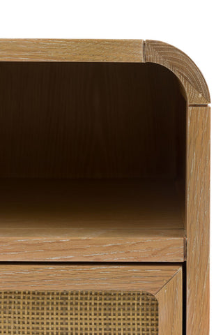 Close-up of the shelf of the Curved Wood & Rattan Bedside Table, on a white background.