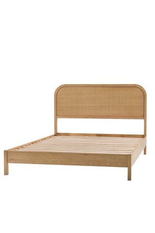 Cutout of the Curved Wood & Rattan Bed on a white background.
