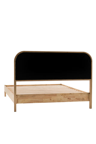 The Curved Wood & Rattan Bed seen from the back, on a white background.
