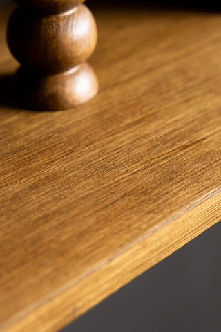The wood texture on the Dark Wood Bobbin 2-Tier Wall Shelf. 