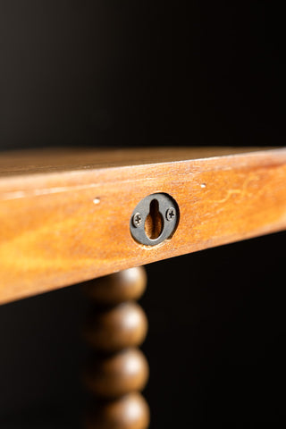 The fixing on the back of the Dark Wood Bobbin 2-Tier Wall Shelf. 