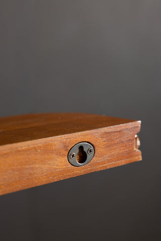 The fixing on the back of the Dark Wood Bobbin Floating Shelf. 