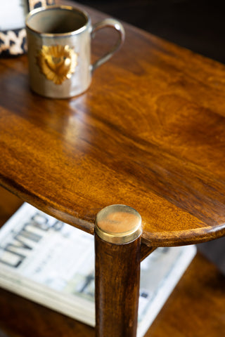 Close-up image of the Dark Wood & Brass Oval Side Table