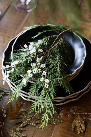 Lifestyle image of the Delicate Pearl-Effect Cluster Decoration on a stack of plates