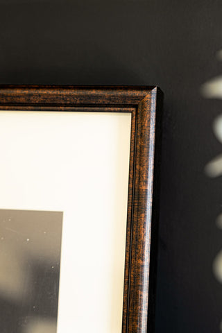 An image showing the corner of the wood-effect frame on the Disco State Of Mind Wall Art.