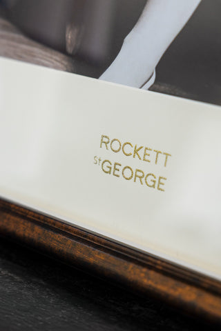 Detail shot of the gold glitter Rockett St George logo on the Disco State Of Mind Wall Art. 