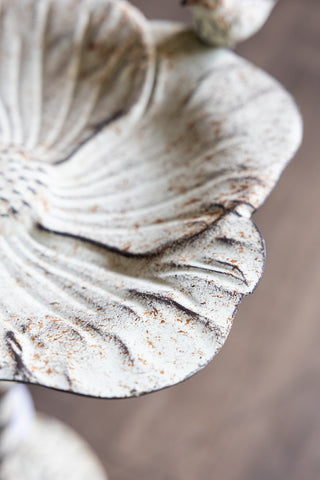 Close-up image of the Distressed Metal Flower Bird Bath