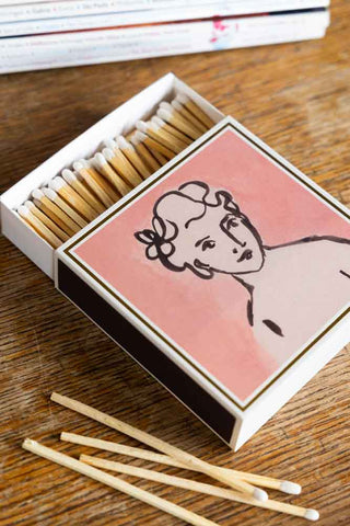 Pink decorative matchbox with a woman