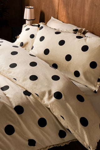 Close up of Dot Noir Ruffled Bedding Set