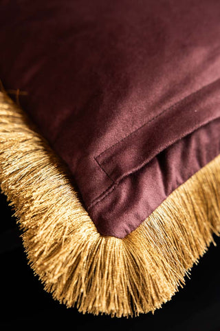 Close-up of the reverse side of the corner of the Dreamland Dragon Fringed Velvet Cushion.