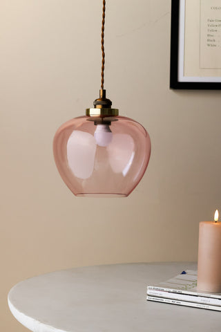 Lifestyle image of the Easyfit Pink Glass Ceiling Light Shade against neutral wall