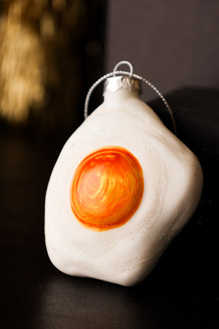 Lifestyle image of the Fried Egg Glass Christmas Decoration