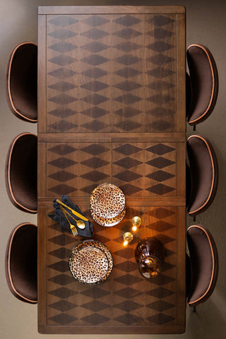 The Emporium Brick Red Extendable Dining Table, shown at full extension from above to reveal the harlequin patten or the wood. 