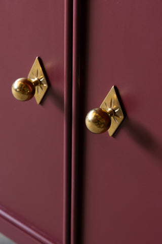 Close-up of the handles on the Emporium Brick Red Sideboard.