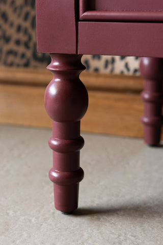 Close-up of the legs of the Emporium Brick Red Sideboard.