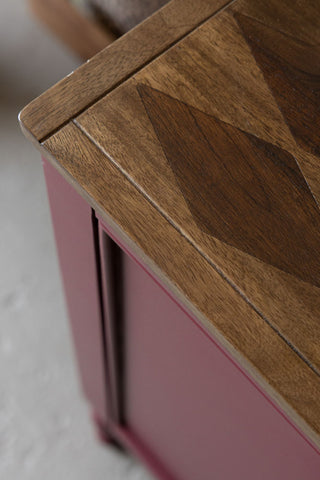 Close-up of the wooden top of the Emporium Brick Red Sideboard.