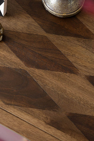 Close-up of the harlequin design on the top of the Emporium Brick Red Sideboard.