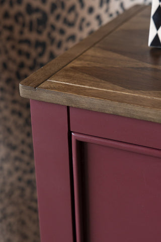 Close-up of the corner of the Emporium Brick Red Sideboard.
