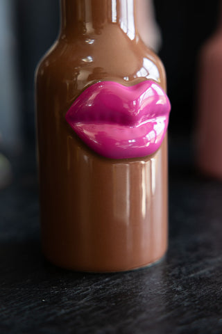 Close-up image of the Small Brown Ceramic Vase With Lips