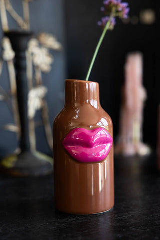 Lifestyle image of the Small Brown Ceramic Vase With Lips