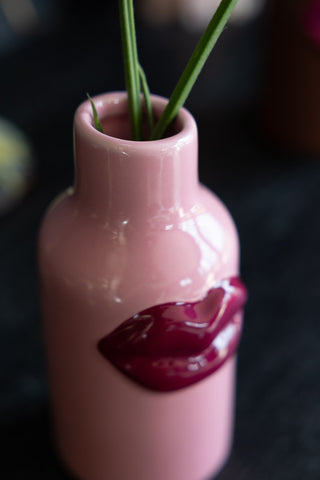 Close-up image of the Small Pink Ceramic Vase With Lips