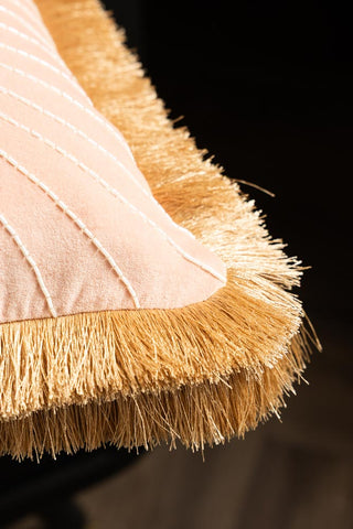 Close-up of the fringing on the corner of the Fancy As Fuck Double-Fringed Pink Velvet Cushion.