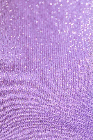 The texture and glitter detail of the purple cotton socks. 