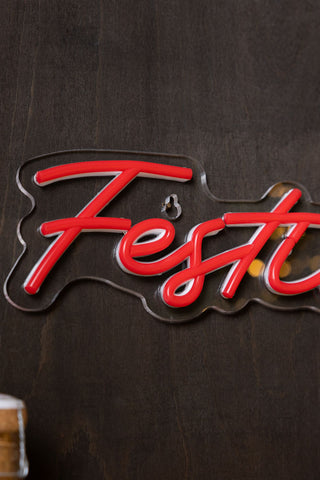 Close-up of a red neon sign on a dark background.