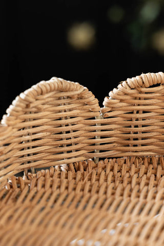 Close-up image of the Footed Round Rattan Scalloped Display Stand