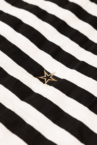 Close-up of the star motif on the Fuck Normal, I Want Magic Print Reversible Quilt.