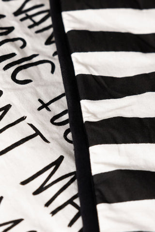 Close-up of the design on both sides of the Fuck Normal, I Want Magic Print Reversible Quilt.