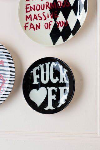 Image of the Fuck Off Decorative Wall Plate on a wall