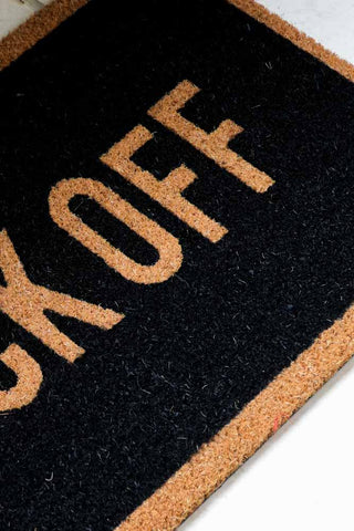 Close-up image of the Fuck Off Doormat