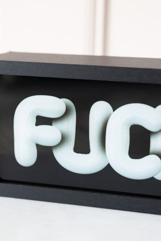 Close-up of the text on the Fuck Off Light Box.