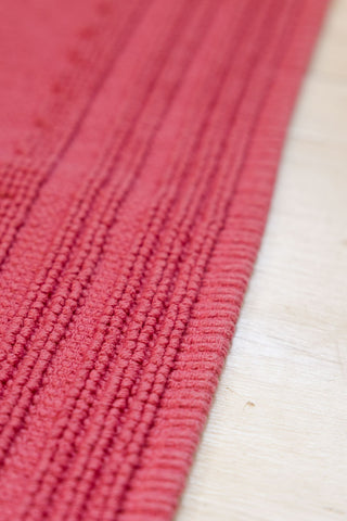 The raised line border on the Fucking Filthy Hot Pink Bath Mat. 