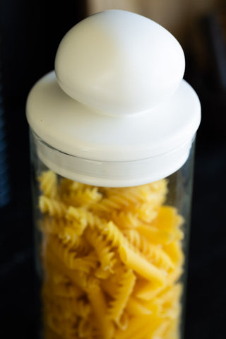 Close-up image of the Glass Storage Jar With White Ceramic Lid - Tall