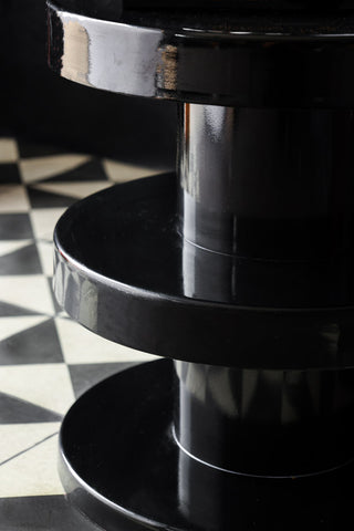 Side profile of the black glossy side table